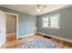 Bedroom with hardwood floors, a ceiling fan, natural light, neutral wall colors, and good storage at 1391 Jefferson Ave, East Point, GA 30344
