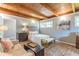 Cozy bedroom showcasing a sitting area, wood floors, and natural light at 1391 Jefferson Ave, East Point, GA 30344