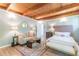 Comfortable bedroom with a sitting area, wooden ceiling and hardwood floors at 1391 Jefferson Ave, East Point, GA 30344