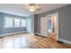 Bright bedroom features hardwood floors, natural light, and closet at 1391 Jefferson Ave, East Point, GA 30344