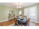 Traditional dining room featuring a round table set for four, bright, natural light, and stylish decorations at 1391 Jefferson Ave, East Point, GA 30344