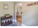 Charming entryway featuring a wooden console table and an arched doorway leading to the dining room at 1391 Jefferson Ave, East Point, GA 30344
