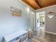 Inviting entryway features tile flooring, a wooden ceiling, and a convenient storage bench with basket storage at 1391 Jefferson Ave, East Point, GA 30344
