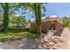 Rear exterior of brick home with a small, grassy yard and driveway at 1391 Jefferson Ave, East Point, GA 30344