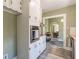 Bright kitchen with stainless steel appliances, including a built-in oven, and white cabinets at 1391 Jefferson Ave, East Point, GA 30344