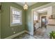 Laundry room with hookups, window, and an attached updated kitchen with new stainless steel appliances at 1391 Jefferson Ave, East Point, GA 30344