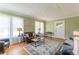 Bright living room featuring hardwood floors, cozy seating, and a welcoming atmosphere for relaxation at 1391 Jefferson Ave, East Point, GA 30344