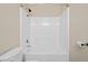 Bathroom with a shower-tub combo and a standard toilet at 174 Randall Dr, Rockmart, GA 30153