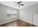 Bright bedroom features hardwood floors, a window, and a ceiling fan at 174 Randall Dr, Rockmart, GA 30153