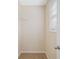 Walk-in closet with beige carpet, neutral walls, wire rack shelving, and a window for ample lighting at 174 Randall Dr, Rockmart, GA 30153