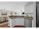 Eat-in kitchen featuring stainless steel appliances and hardwood floors at 174 Randall Dr, Rockmart, GA 30153
