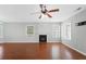 Large living room with hardwood floors, a fireplace, and plenty of natural light at 174 Randall Dr, Rockmart, GA 30153
