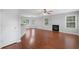 Large living room with hardwood floors, a fireplace, and plenty of natural light at 174 Randall Dr, Rockmart, GA 30153