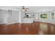 Open-concept living area with hardwood floors, updated lighting and many windows at 174 Randall Dr, Rockmart, GA 30153