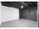 Basement space with concrete floors and dark walls, offering potential for storage or customization at 3228 Turtle Lake Se Dr, Marietta, GA 30067
