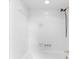 Bright bathtub area featuring white tiles and sleek gold fixtures at 3228 Turtle Lake Se Dr, Marietta, GA 30067