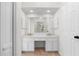 Bathroom with a large vanity with dual sinks and bright lighting at 3228 Turtle Lake Se Dr, Marietta, GA 30067