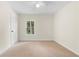 Bedroom featuring plush carpeting, a window, and light-colored walls at 3228 Turtle Lake Se Dr, Marietta, GA 30067