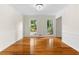 Open dining room features hardwood floors, chair rail, and elegant lighting at 3228 Turtle Lake Se Dr, Marietta, GA 30067