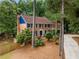 Charming two-story brick home with a dark blue front door and shutters at 3228 Turtle Lake Se Dr, Marietta, GA 30067