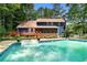 Exterior back of home showing pool, deck, patio and screened in porch at 3228 Turtle Lake Se Dr, Marietta, GA 30067