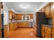 Well-lit kitchen with wood cabinets, granite countertops and stainless steel appliances at 3228 Turtle Lake Se Dr, Marietta, GA 30067