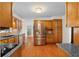 Updated kitchen features hardwood floors, stainless steel appliances, and wooden cabinetry at 3228 Turtle Lake Se Dr, Marietta, GA 30067