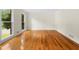 Bright living room features hardwood floors, white trim, and a double window at 3228 Turtle Lake Se Dr, Marietta, GA 30067