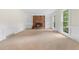Spacious living room with a brick fireplace, built-in bookshelves and large windows at 3228 Turtle Lake Se Dr, Marietta, GA 30067