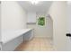 Office area features a built-in desk area, tile floors and a bright window at 3228 Turtle Lake Se Dr, Marietta, GA 30067