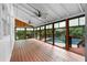 Relaxing sunroom featuring multiple windows, ceiling fans and pool views at 3228 Turtle Lake Se Dr, Marietta, GA 30067