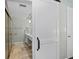 Bathroom showing the vanity, and tiled shower, and a white sliding door at 6851 Roswell Rd # H18, Atlanta, GA 30328