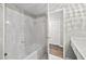 Bright bathroom showcasing a white tiled shower-tub and convenient access to the vanity at 6851 Roswell Rd # H18, Atlanta, GA 30328