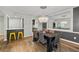 Charming dining room featuring a modern chandelier, seating for six, and wood flooring at 6851 Roswell Rd # H18, Atlanta, GA 30328