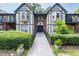 Stylish condominium exterior with manicured landscaping, a walkway and unique architectural details at 6851 Roswell Rd # H18, Atlanta, GA 30328