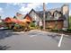 Elegant two-story building with a covered entrance, manicured landscaping, and ample parking at 6851 Roswell Rd # H18, Atlanta, GA 30328