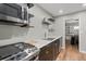 This modern kitchen features stainless steel appliances, floating shelves, and a stylish backsplash at 6851 Roswell Rd # H18, Atlanta, GA 30328