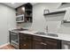 Updated kitchen with stainless steel appliances, sleek countertops, modern sink, and wood cabinetry at 6851 Roswell Rd # H18, Atlanta, GA 30328