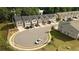 Aerial view of a community showcasing street, landscaping, and surrounding neighborhood at 1825 Villageside Ct, Lawrenceville, GA 30043