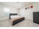 Cozy bedroom with carpet flooring, neutral walls, closet, and natural light from the window at 1825 Villageside Ct, Lawrenceville, GA 30043
