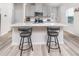 Contemporary kitchen with gray cabinets, quartz countertops, and a breakfast bar at 1825 Villageside Ct, Lawrenceville, GA 30043