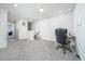 Spacious loft area with carpet flooring and a desk, great for a home office or additional living space at 1825 Villageside Ct, Lawrenceville, GA 30043