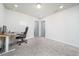 Home office with neutral decor, a desk with a computer, and carpet flooring for a comfortable workspace at 1825 Villageside Ct, Lawrenceville, GA 30043