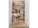 Well-organized pantry with shelving stocked with a variety of food and household items at 1825 Villageside Ct, Lawrenceville, GA 30043
