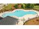 Community pool with lounge chairs and beautiful landscaping at 1825 Villageside Ct, Lawrenceville, GA 30043