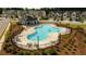 Community pool with lounge chairs and shaded area at 1825 Villageside Ct, Lawrenceville, GA 30043