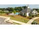 View of community pool and clubhouse with lush green surroundings on a sunny day at 1825 Villageside Ct, Lawrenceville, GA 30043