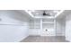 Spacious finished basement with gray wood floors and built-in shelving, perfect for entertaining at 2726 Riderwood Ne Ln, Marietta, GA 30062