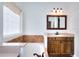 Bathroom featuring a soaking tub beneath a privacy window at 2726 Riderwood Ne Ln, Marietta, GA 30062