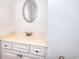 Bathroom vanity features white cabinets, a sink, mirror, and neutral finishes at 2726 Riderwood Ne Ln, Marietta, GA 30062